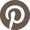 The Pinterest logo in Armande Darcy brown.